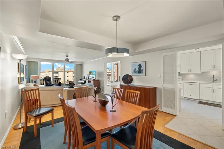 Dining area featuring light wood-style floors and ceiling fan