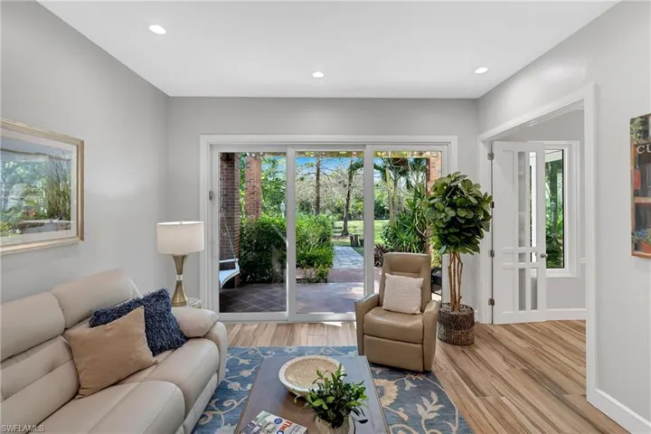 Living area featuring light wood-type flooring and recessed lighting