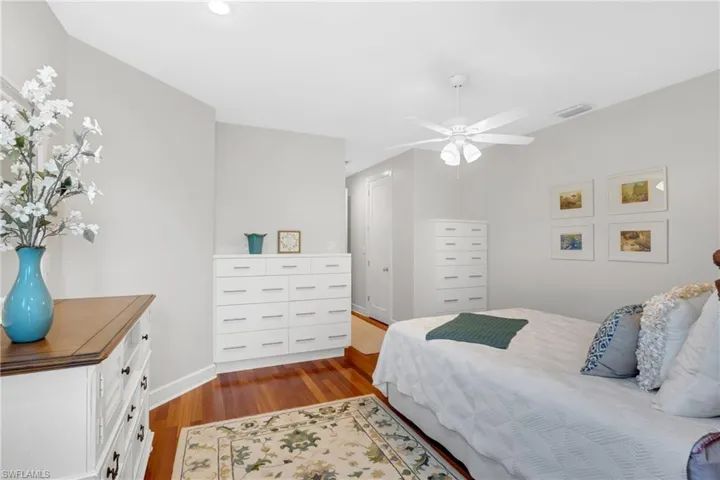 Bedroom featuring dark wood finished floors and a ceiling fan