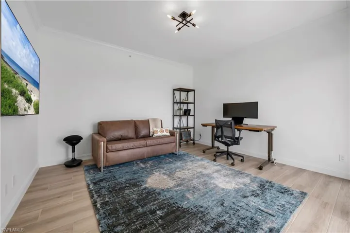 Bedroom 3/den w/ crown molding and hardwood / wood-style floors