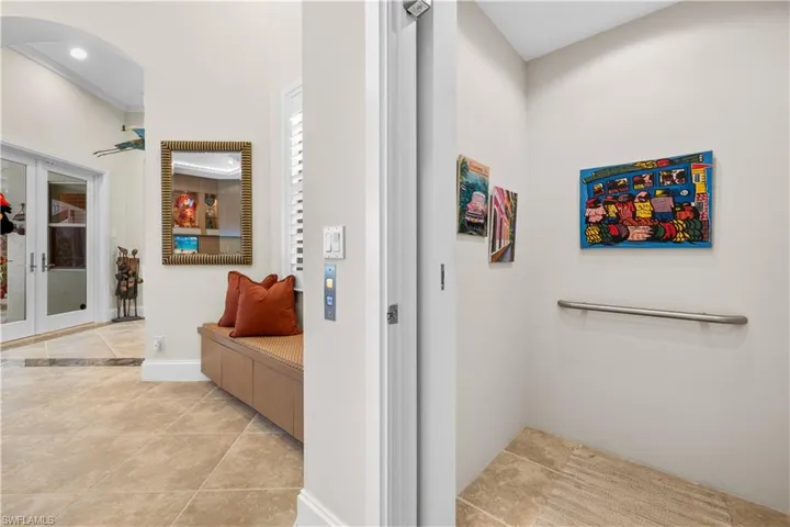 Hallway featuring light tile patterned flooring