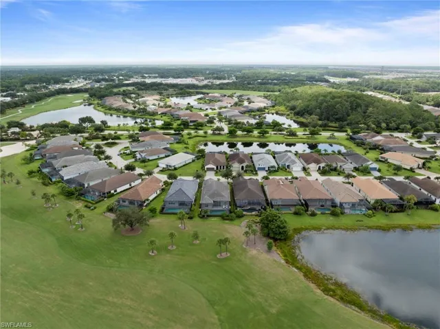Aerial perspective showcasing a residential community with multiple single-story homes