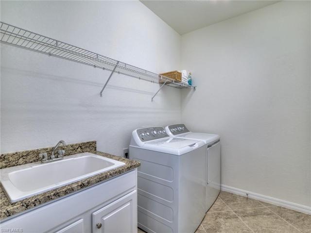 Utility room with large wash sink.