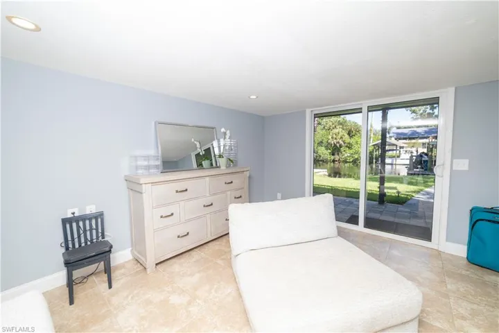 Living area featuring expansive windows and light tile patterned floors