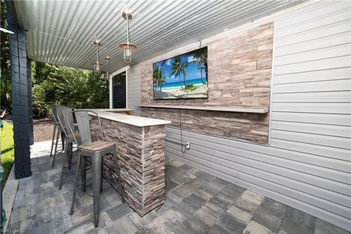 View of patio with a bar