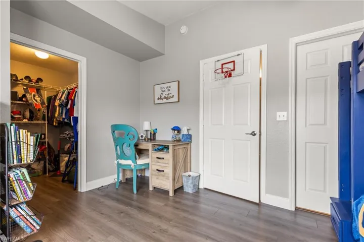 Home office featuring dark hardwood / wood-style flooring