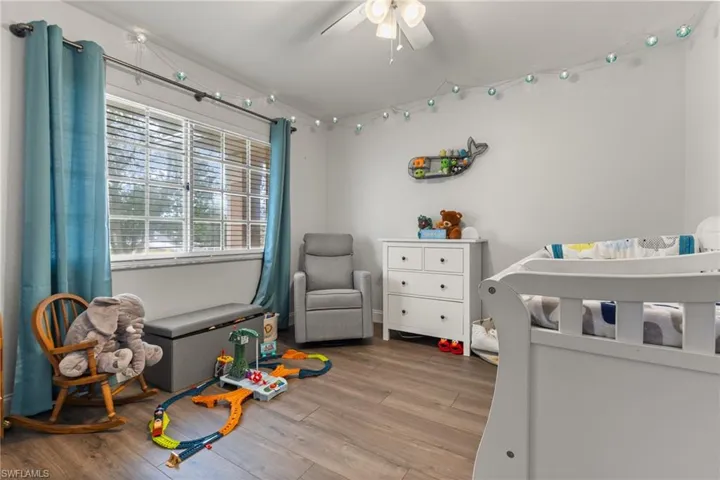 Bedroom featuring hardwood / wood-style floors and ceiling fan