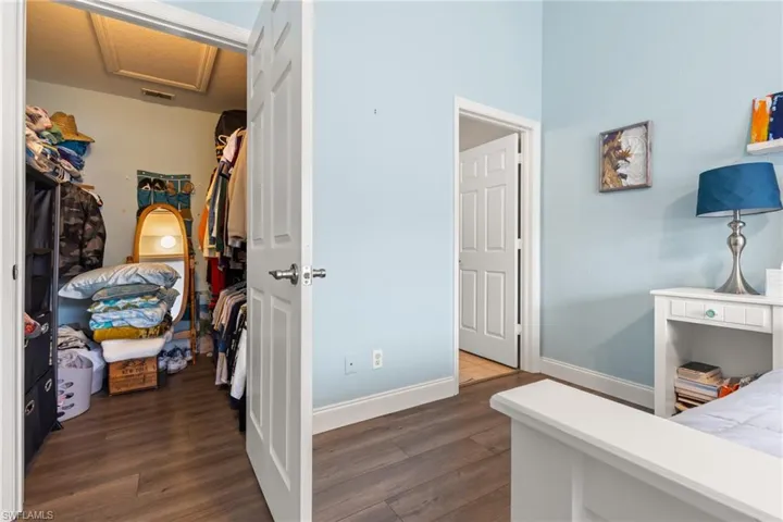 Bedroom featuring dark hardwood / wood-style flooring
