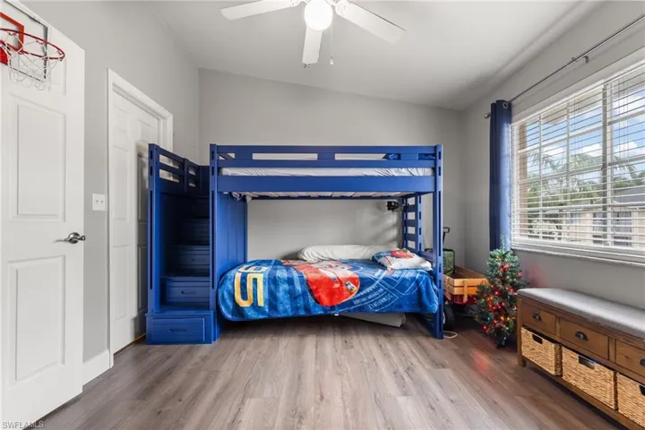 Bedroom featuring wood-type flooring and ceiling fan