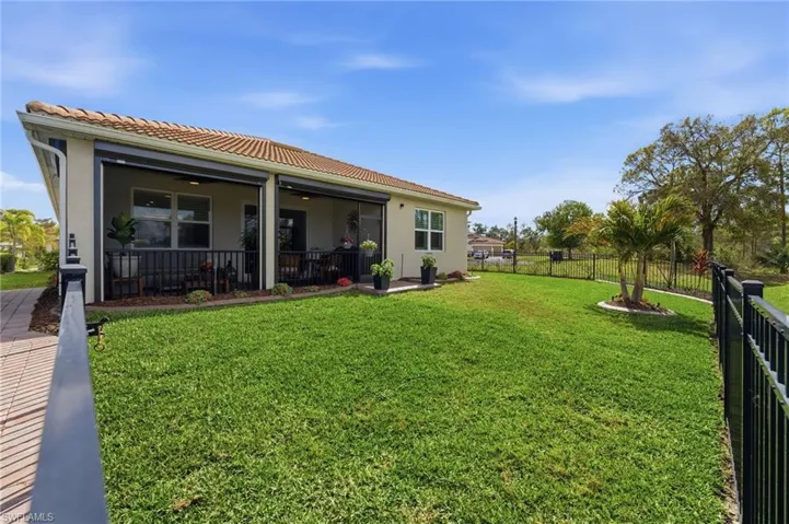 Large screened in lanai with fenced yard.  Room for a pool.