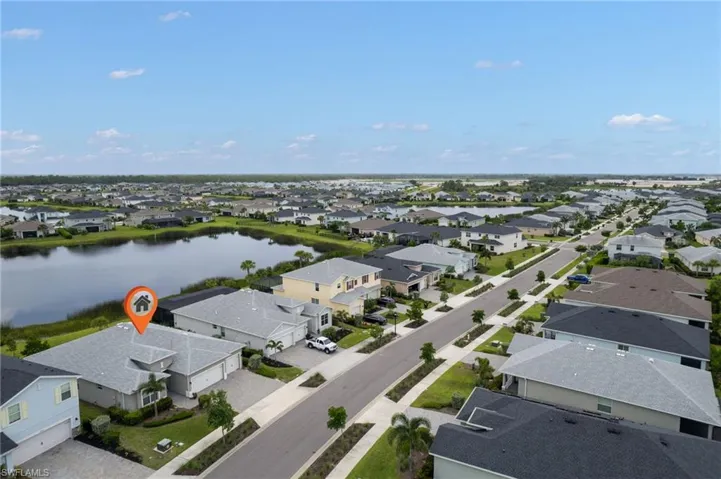Aerial perspective of suburban area with a nearby body of water