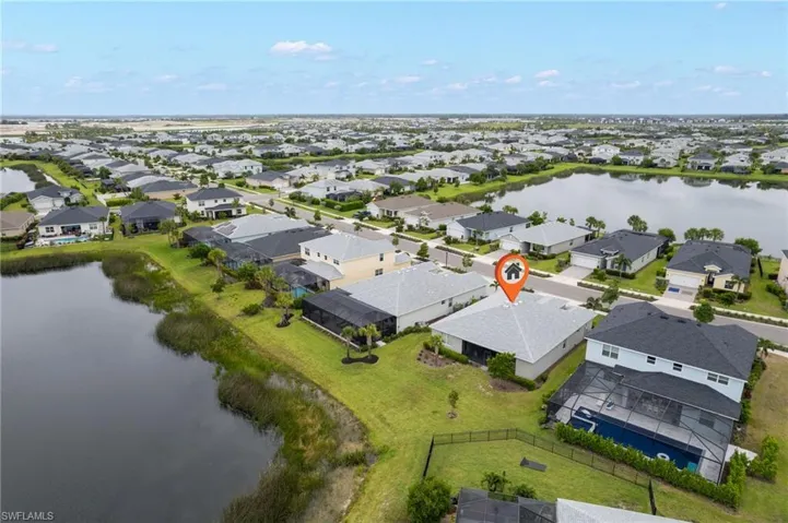 Aerial view of residential area with a large body of water
