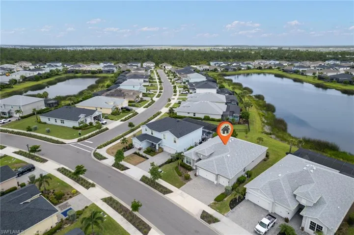 Aerial perspective of suburban area with a large body of water