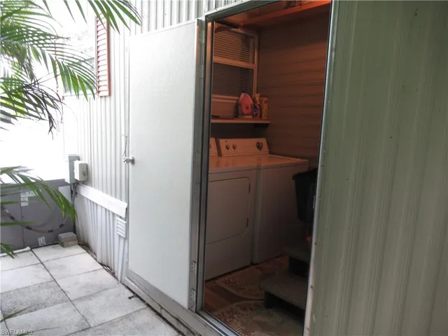 Laundry area featuring separate washer and dryer