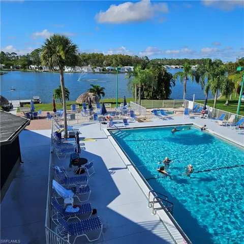 Community pool with a patio
