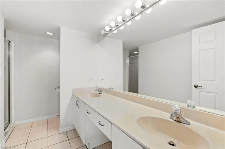Double vanities in primary, cabinet fronts have been  replaced, not reflected in photo.
