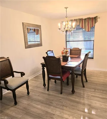 Dining space featuring a chandelier and light wood-style floors