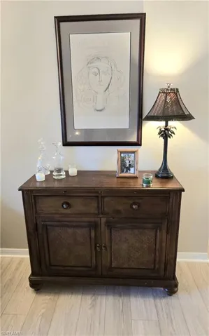 Detailed view of wood finished floors and baseboards