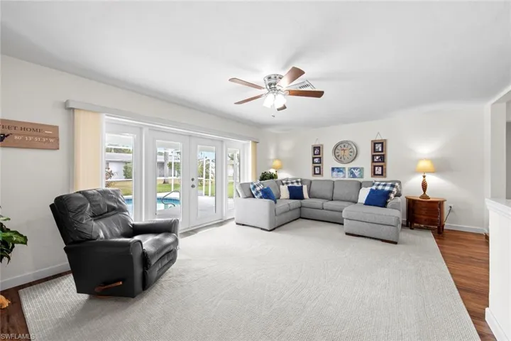 Enjoy this stunning Family Room off the kitchen with sliders leading to the lanai and pool.