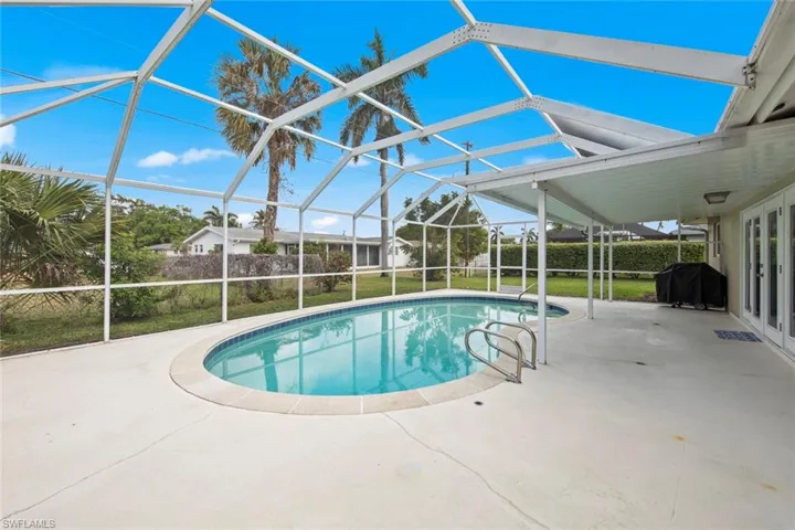 Resurfaced, new tiled beautiful pool with a large covered space.
