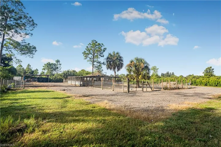 View of jungle gym with a rural view