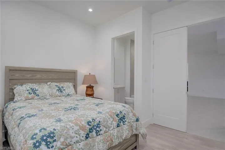 Bedroom featuring wood finished floors and recessed lighting