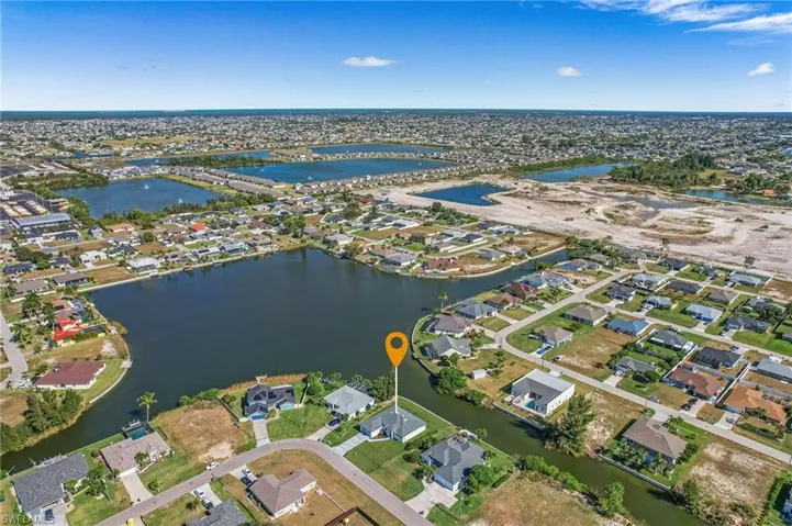 View of property location featuring nearby suburban area and a large body of water