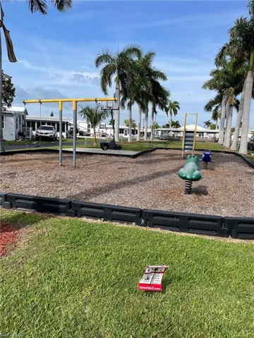 View of play area with a lawn