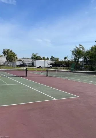 View of sport court featuring basketball hoop