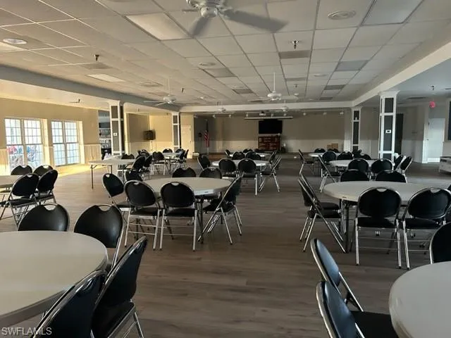 Stage, event Dining room with a paneled ceiling and dark wood finished floors