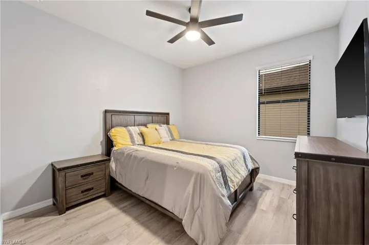 Wood-finish flooring with a modern ceiling fan