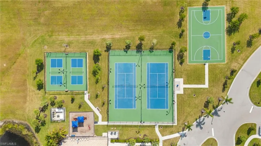 Outdoor basketball court, multiple tennis courts, multiple pickleball courts, playground structure, and paved pathways