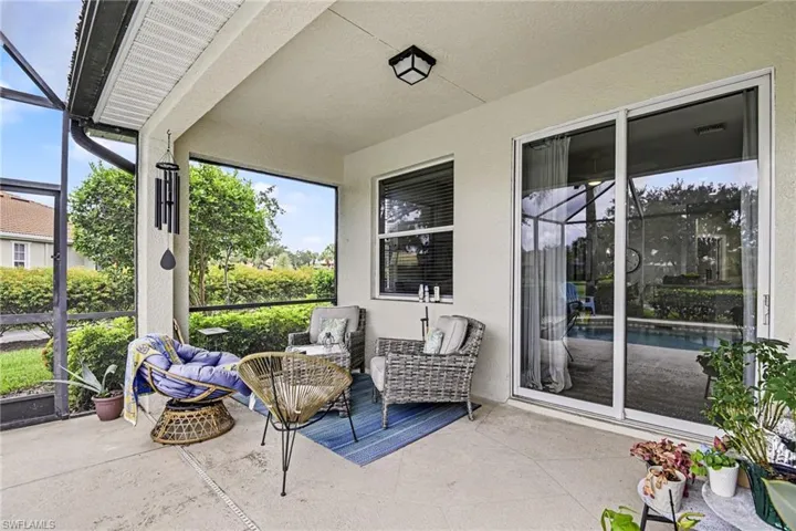 Screened patio featuring concrete flooring and a textured ceiling