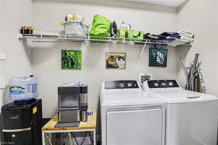 Dedicated laundry area featuring a white wire shelving unit, providing storage space