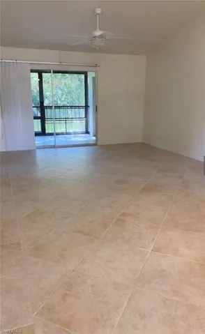 Spare room with ceiling fan