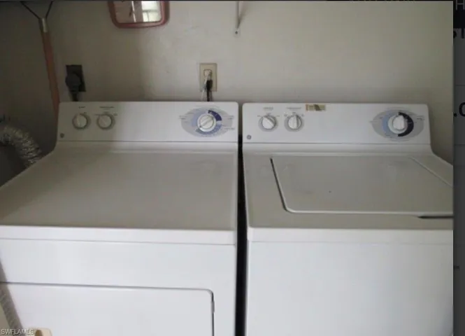 Laundry area with washing machine and clothes dryer