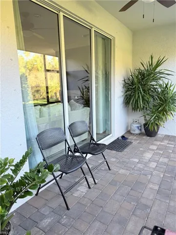 View of patio with a ceiling fan
