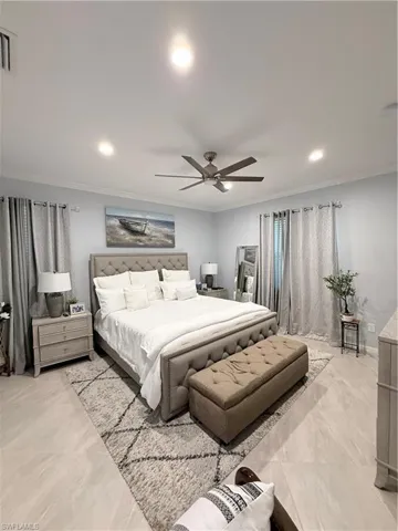 Bedroom with recessed lighting, crown molding, and a ceiling fan