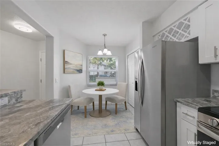 Breakfast nook with pantry. This image has been virtually staged for illustrative purposes. Furniture and décor shown are digital and are not present in the home. Room sizes and furniture scale may not be exact.
