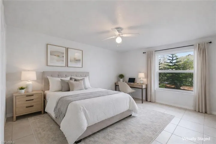 3rd Bedroom with closet. This image has been virtually staged for illustrative purposes. Furniture and décor shown are digital and are not present in the home. Room sizes and furniture scale may not be exact.