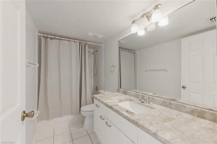Full Guest bath featuring updated countertops