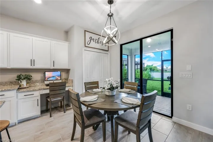 Tiled dining room with an inviting chandelier