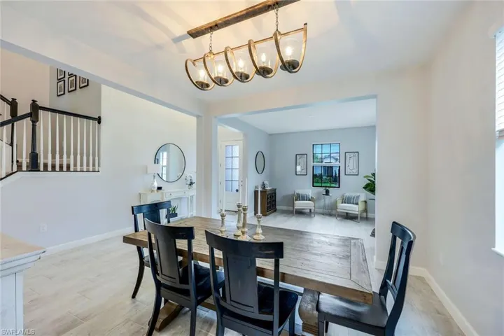 Dining area with a chandelier and light hardwood / wood-style floors
