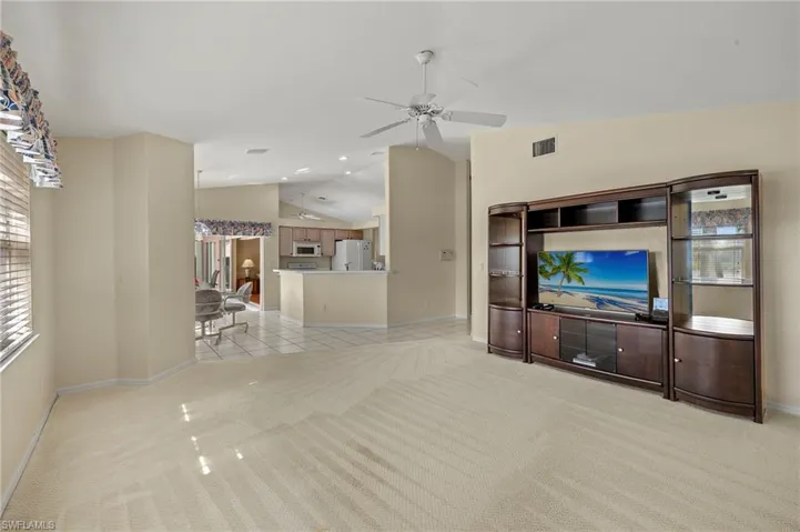 Bright and open family room flows into kitchen.