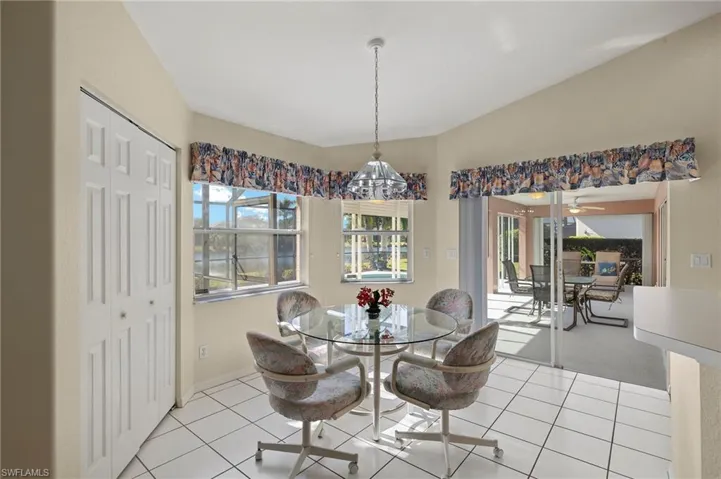 Eat-in kitchen with custom bar closet.