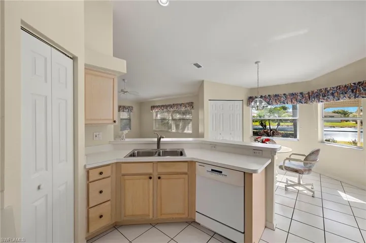Bright kitchen with vaulted ceiling.