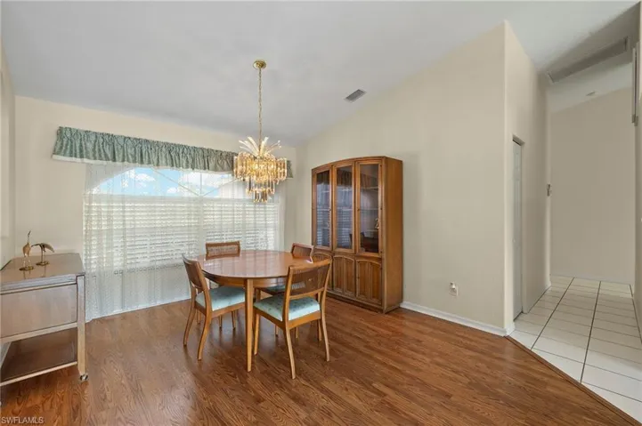 Dining room with vaulted ceilings.