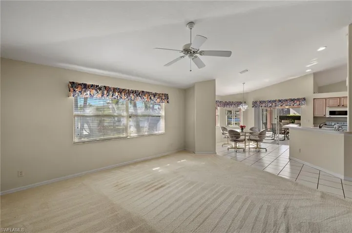 Bright open family room flows into kitchen and onto lanai.