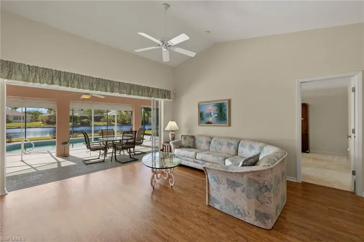 Living room featuring lofted ceiling and a healthy amount of sunlight.