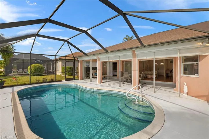 Screened pool, deck for sunbathing, covered lanai and electric storm shutters for peace of mind.